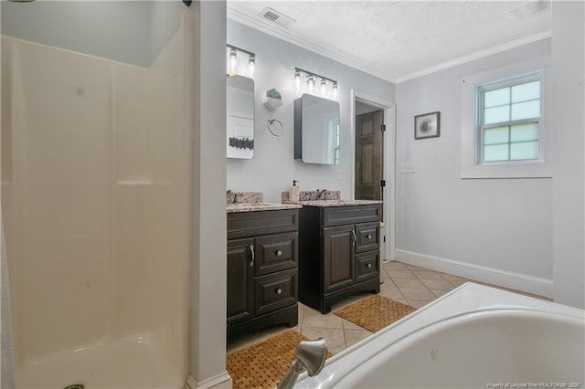 bathroom featuring tile patterned floors, vanity, a textured ceiling, and ornamental molding