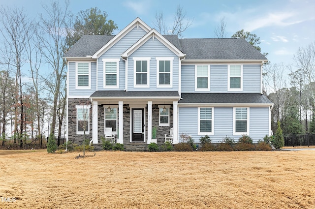 view of front of house featuring a porch and a front lawn