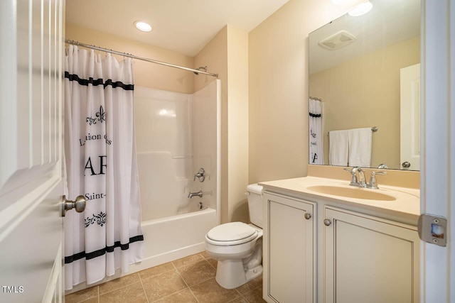 full bathroom featuring vanity, toilet, tile patterned flooring, and shower / bath combo