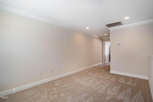 carpeted empty room featuring crown molding