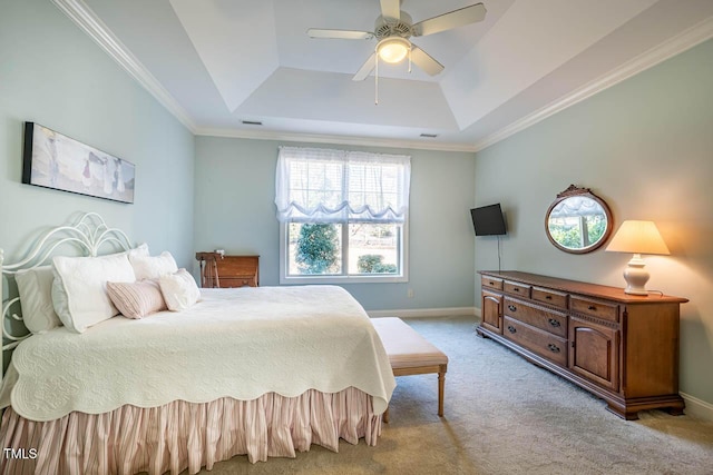 carpeted bedroom featuring ornamental molding, a raised ceiling, and ceiling fan