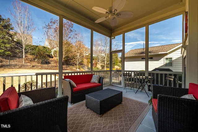 sunroom / solarium with ceiling fan