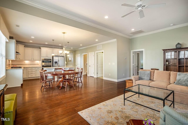 living room featuring ornamental molding, dark wood-type flooring, and ceiling fan with notable chandelier