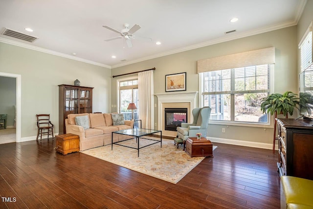 living room featuring crown molding, dark hardwood / wood-style floors, and ceiling fan