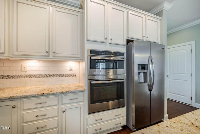 kitchen featuring stainless steel appliances, crown molding, backsplash, and light stone counters