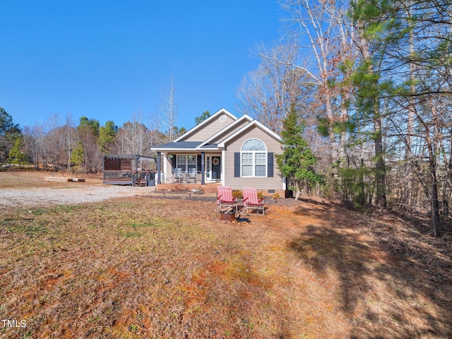 view of front of home with a pergola, a front lawn, and a porch