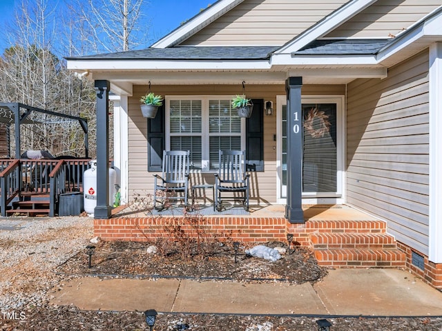 doorway to property with covered porch