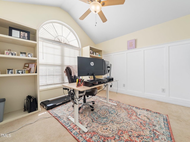 carpeted office with ceiling fan and lofted ceiling