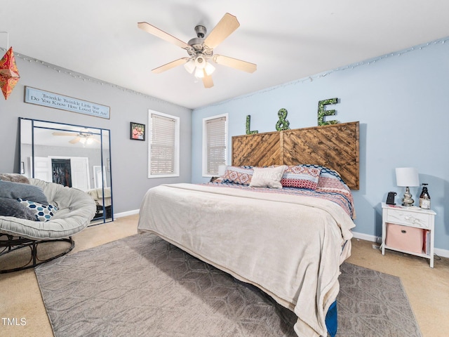 bedroom featuring ceiling fan and light colored carpet