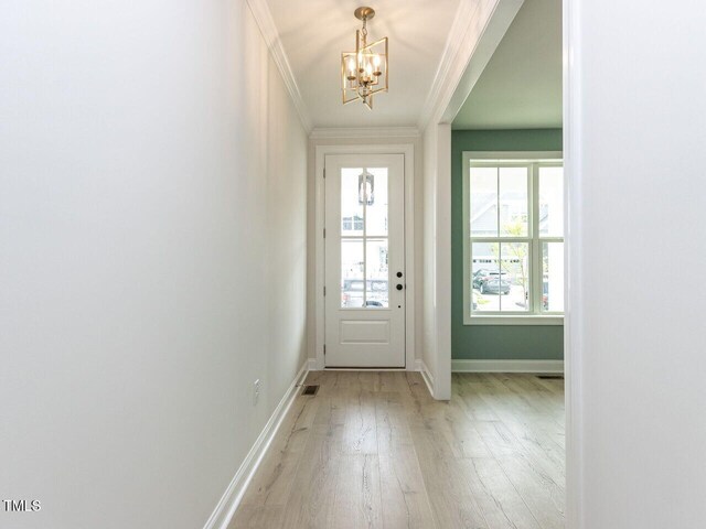 1813 Bright Lantern Way, Wendell, NC 27591 - entrance foyer featuring a chandelier, light wood-style flooring, ornamental molding, and baseboards