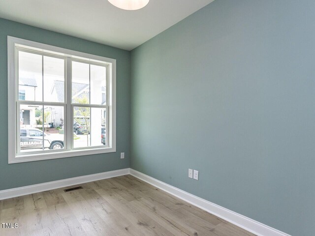 1813 Bright Lantern Way, Wendell, NC 27591 - empty room featuring baseboards and light wood finished floors