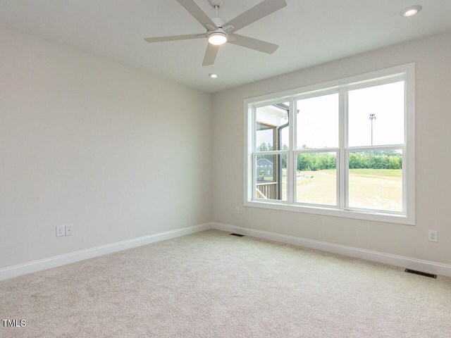 1813 Bright Lantern Way, Wendell, NC 27591 - spare room featuring light colored carpet, baseboards, recessed lighting, and ceiling fan