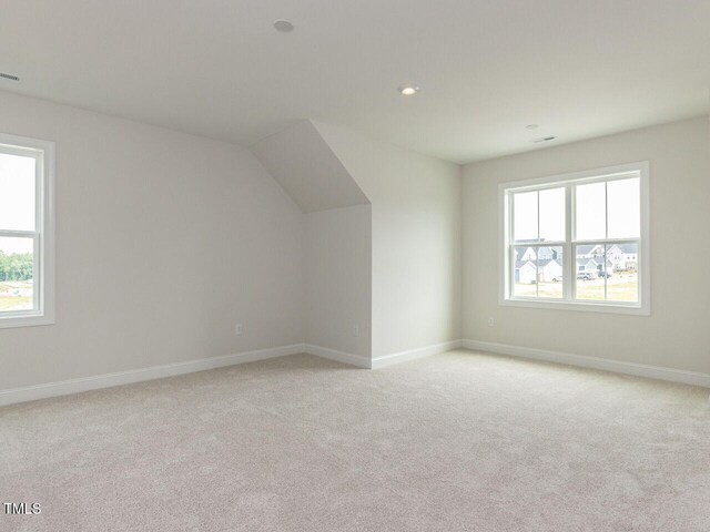 1813 Bright Lantern Way, Wendell, NC 27591 - additional living space featuring plenty of natural light, light colored carpet, baseboards, and recessed lighting