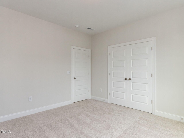 1813 Bright Lantern Way, Wendell, NC 27591 - unfurnished bedroom with carpet floors, a closet, and baseboards