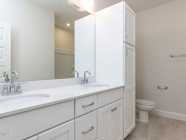 1813 Bright Lantern Way, Wendell, NC 27591 - bathroom featuring double vanity, toilet, and baseboards