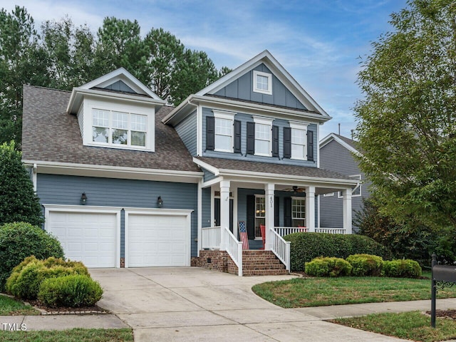 view of front of property with a garage and a porch