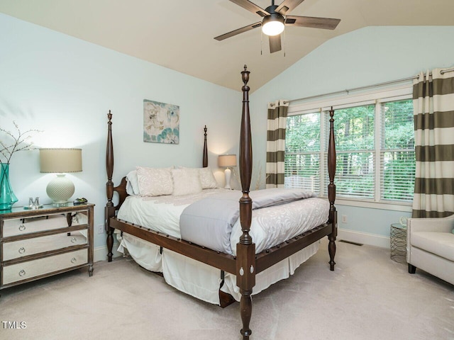 bedroom featuring ceiling fan, lofted ceiling, and light carpet