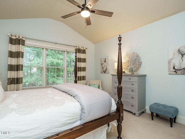 carpeted bedroom featuring vaulted ceiling and ceiling fan