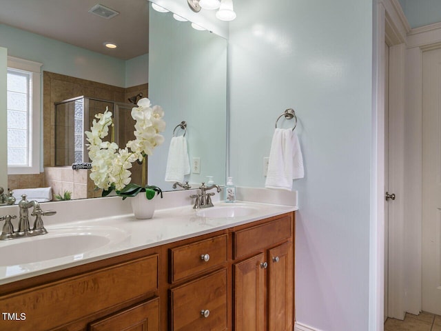 bathroom with vanity and an enclosed shower