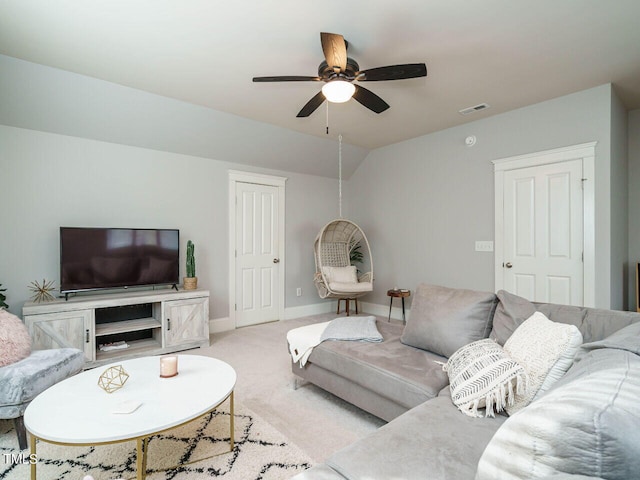 carpeted living room featuring vaulted ceiling and ceiling fan