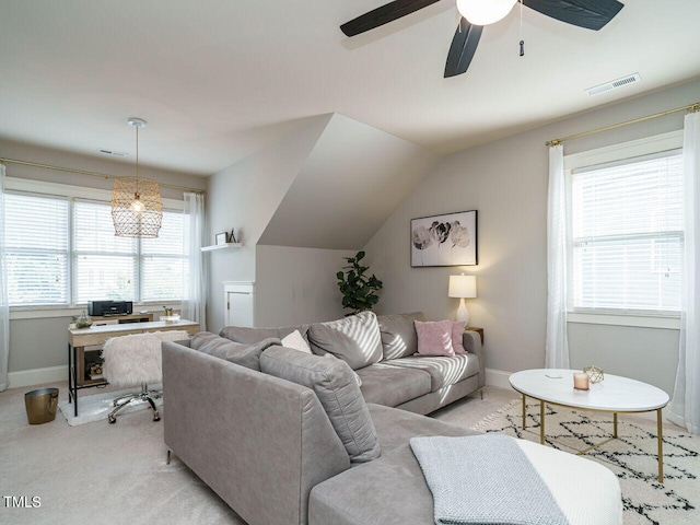 living room featuring lofted ceiling, light carpet, and ceiling fan