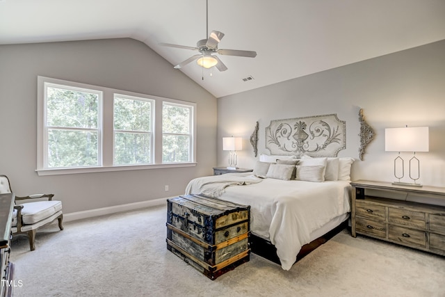 bedroom with light carpet, vaulted ceiling, and ceiling fan