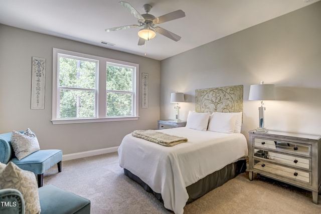 bedroom featuring ceiling fan and light colored carpet