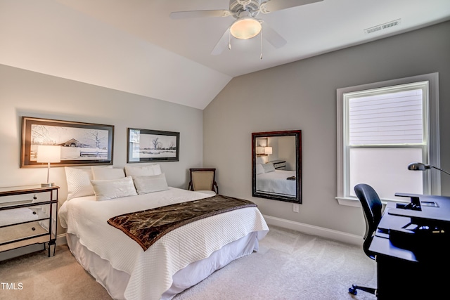 bedroom featuring ceiling fan, lofted ceiling, and light carpet