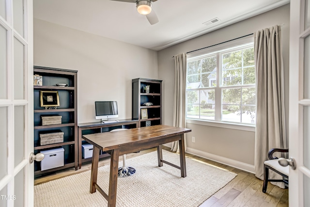 office area featuring ceiling fan and light hardwood / wood-style floors