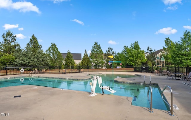 view of swimming pool with a patio