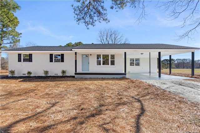 ranch-style home with a carport