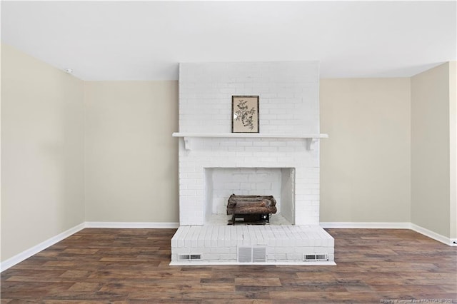 interior space featuring a brick fireplace and wood-type flooring