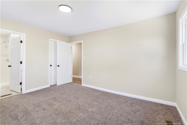 unfurnished bedroom featuring carpet floors