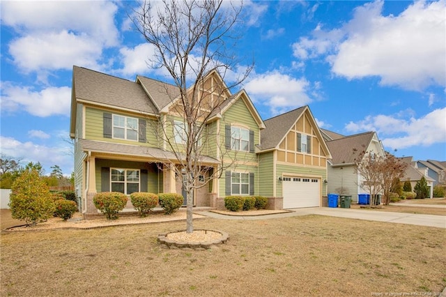 view of front of house featuring a garage and a front lawn