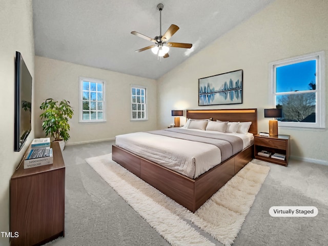 bedroom with light carpet, lofted ceiling, and ceiling fan