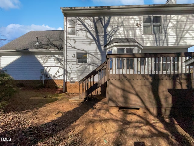 back of property featuring a deck