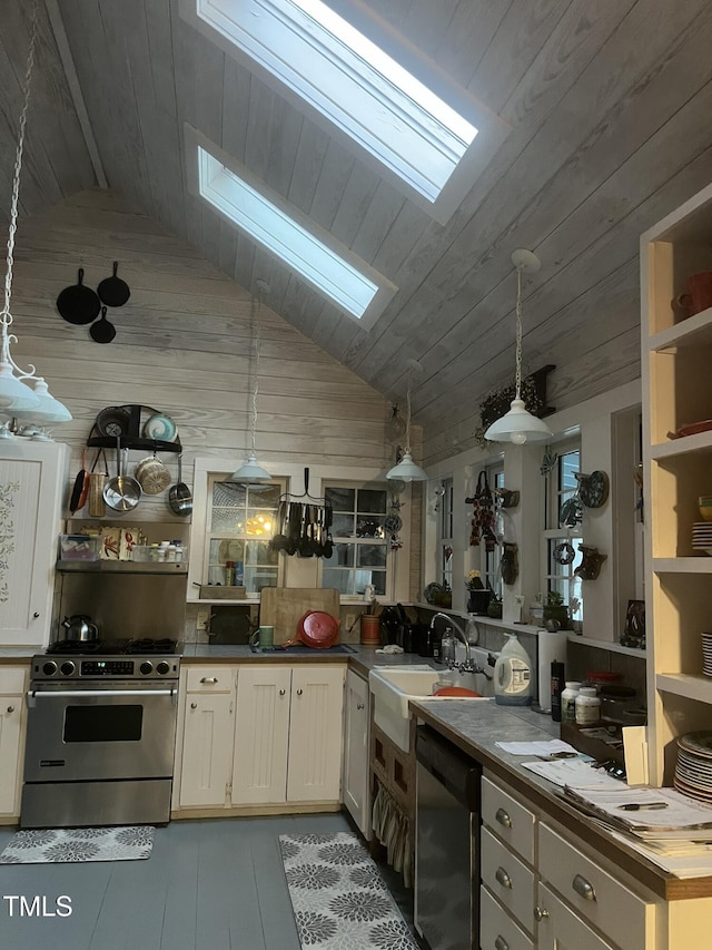 kitchen featuring sink, wooden counters, dishwasher, hanging light fixtures, and stainless steel range with gas cooktop