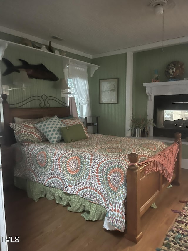 bedroom featuring wood-type flooring