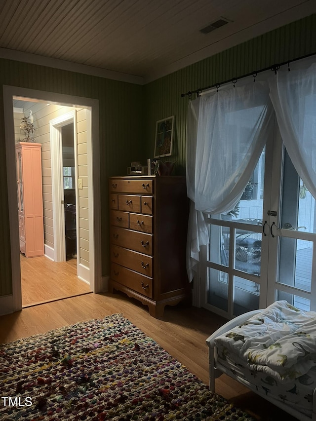 bedroom with hardwood / wood-style floors