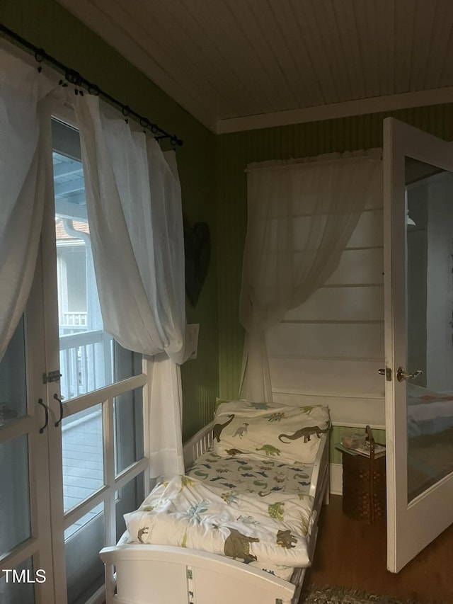 bedroom featuring hardwood / wood-style floors and wooden ceiling