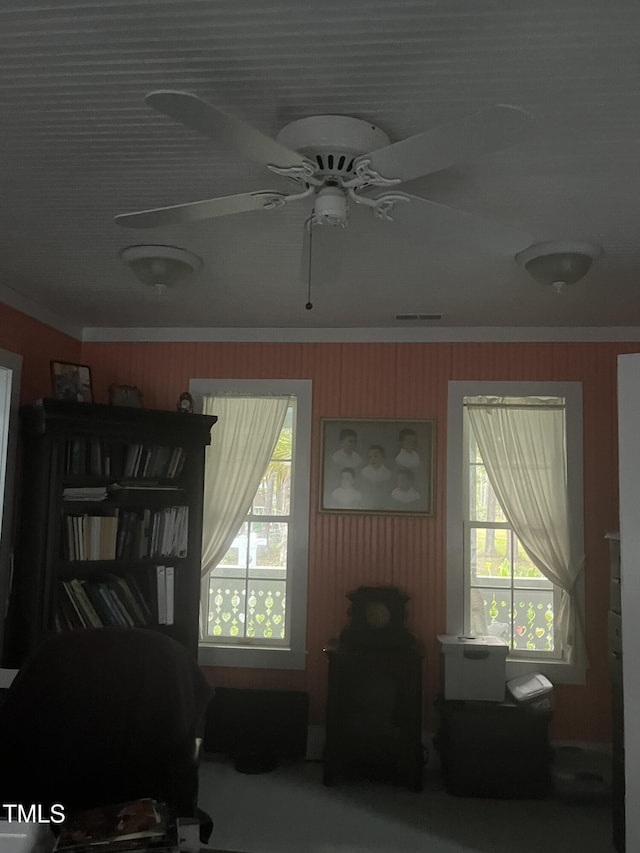 bedroom with crown molding and ceiling fan