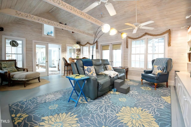 living room featuring wood ceiling, french doors, ceiling fan, and wood walls