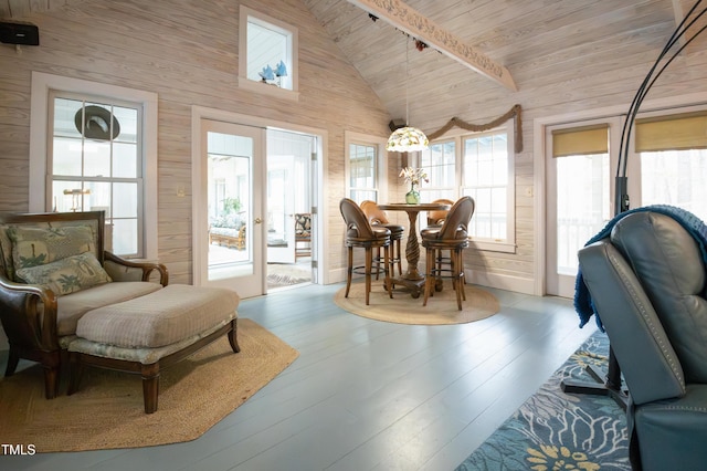 sunroom featuring french doors, lofted ceiling, and wooden ceiling