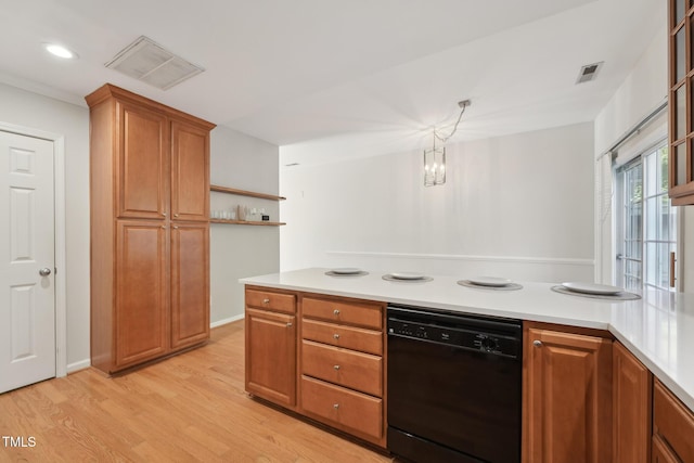 kitchen with dishwasher, light hardwood / wood-style floors, and decorative light fixtures