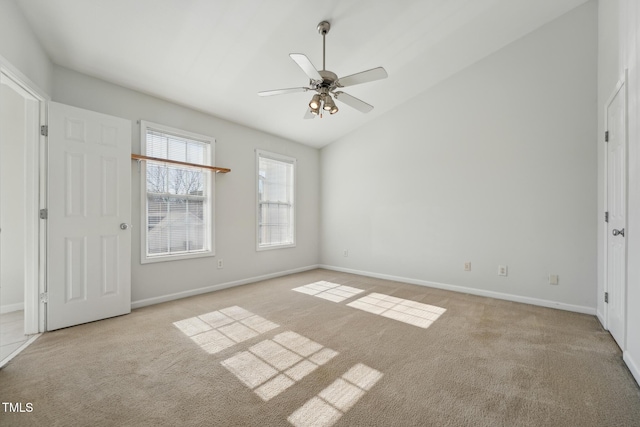 unfurnished bedroom with vaulted ceiling, light colored carpet, and ceiling fan