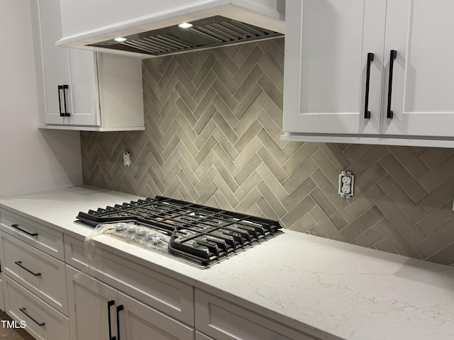 118 Sanderway Dr, Chapel Hill, NC 27516 - kitchen with premium range hood, stainless steel gas stovetop, white cabinetry, and decorative backsplash