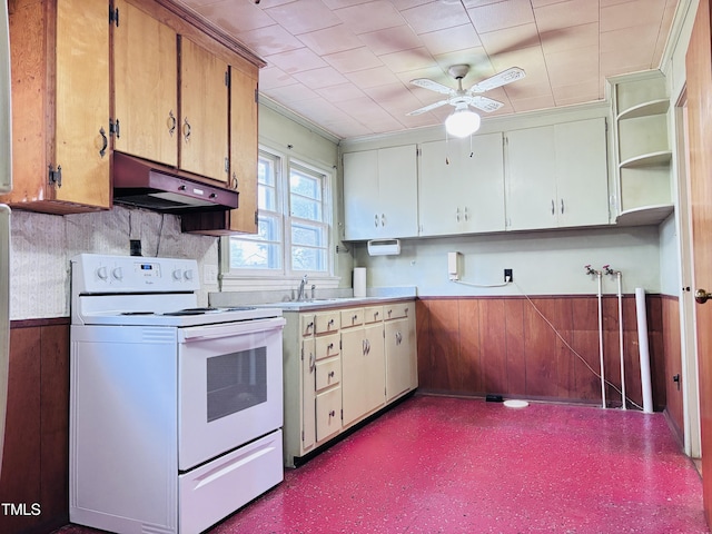 kitchen with white electric range, sink, exhaust hood, ceiling fan, and white cabinets