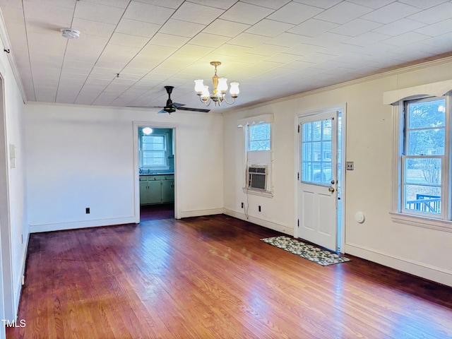 entryway featuring hardwood / wood-style flooring, crown molding, a healthy amount of sunlight, and cooling unit