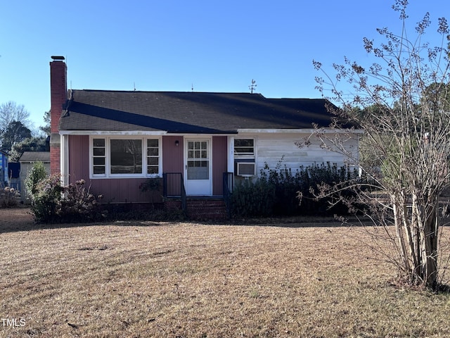 ranch-style home with a front yard