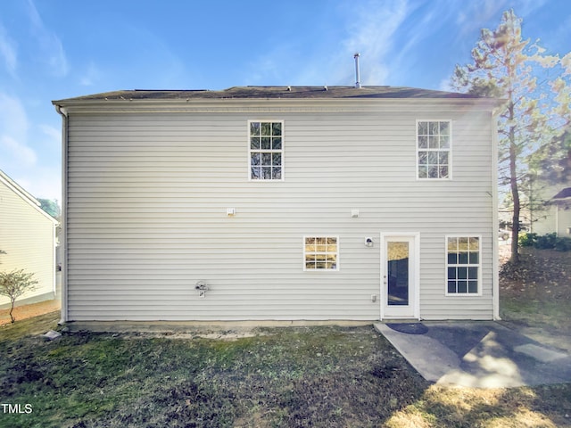 back of property featuring a patio